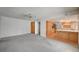 Cozy living area adjacent to the kitchen, featuring neutral colors and carpet at 3143 El Chico Ct, Las Vegas, NV 89120