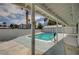 Inviting swimming pool in a fenced backyard with a covered patio, perfect for relaxing and entertaining at 3143 El Chico Ct, Las Vegas, NV 89120