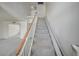 View of the staircase with chair lift to the upper level at 3143 El Chico Ct, Las Vegas, NV 89120