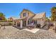 Backyard patio with brick pavers, lounge chair, grill, and covered area with outdoor seating at 3440 Meridale Dr, Las Vegas, NV 89117