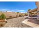 Expansive backyard with a stone patio, and plenty of potential for landscaping and outdoor enjoyment at 3440 Meridale Dr, Las Vegas, NV 89117