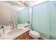 Well-lit bathroom featuring a vanity with ample counter space and a shower with a curtain at 3440 Meridale Dr, Las Vegas, NV 89117