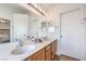 Bathroom vanity with double sinks, ample counter space, and bright lighting at 3440 Meridale Dr, Las Vegas, NV 89117