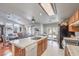 Spacious kitchen with an island that includes a sink, a dishwasher, and wood cabinets at 3440 Meridale Dr, Las Vegas, NV 89117