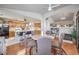 Dining area, kitchen with a breakfast bar, oak cabinets and view of fireplace at 3440 Meridale Dr, Las Vegas, NV 89117