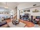Open concept living room with hardwood floors and staircase that leads to the second floor at 3440 Meridale Dr, Las Vegas, NV 89117