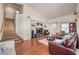 Open concept living room with hardwood floors and staircase that leads to the second floor at 3440 Meridale Dr, Las Vegas, NV 89117