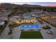 Stunning aerial view of the property featuring pool, outdoor seating, and desert landscaping at 4050 N Tomsik St, Las Vegas, NV 89129