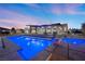 Backyard showcasing a modern pool with integrated lighting and a luxurious aesthetic at 4050 N Tomsik St, Las Vegas, NV 89129