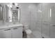 Modern bathroom featuring marble-style tiling, glass shower, and contemporary vanity at 4050 N Tomsik St, Las Vegas, NV 89129