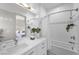 Bright bathroom with modern fixtures, a shower-tub combination, and stylish vanity, creating a spa-like experience at 4050 N Tomsik St, Las Vegas, NV 89129