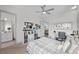 Stylish bedroom with a ceiling fan, cozy bed, and a view into the bathroom offering comfort and convenience at 4050 N Tomsik St, Las Vegas, NV 89129