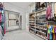 Organized closet with shelves for shoes, clothes racks, and full-length mirror at 4050 N Tomsik St, Las Vegas, NV 89129