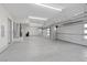 Spacious five car garage with epoxy floors, white doors and walls at 4050 N Tomsik St, Las Vegas, NV 89129