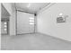 Spacious three car garage with epoxy floors, white doors and walls at 4050 N Tomsik St, Las Vegas, NV 89129