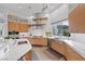 Modern kitchen features stainless appliances, large sink, stone countertops and plenty of natural light at 4050 N Tomsik St, Las Vegas, NV 89129