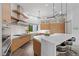 Gourmet kitchen features a large island with seating, modern cabinetry, and stainless steel appliances at 4050 N Tomsik St, Las Vegas, NV 89129