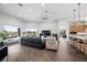 Spacious living room boasts hardwood floors, recessed lighting, and large windows with manicured backyard views at 4050 N Tomsik St, Las Vegas, NV 89129