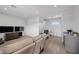 Bright living room features hardwood floors, recessed lighting, and comfortable seating, perfect for relaxation and entertainment at 4050 N Tomsik St, Las Vegas, NV 89129