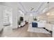 Spacious main bedroom with a modern design, en-suite bathroom and a cozy seating area at 4050 N Tomsik St, Las Vegas, NV 89129
