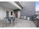 Elegant outdoor kitchen with stainless steel appliances, marble countertops, and dining area for entertaining at 4050 N Tomsik St, Las Vegas, NV 89129