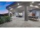 Spacious covered patio with outdoor seating and dining, perfect for enjoying the backyard view at 4050 N Tomsik St, Las Vegas, NV 89129