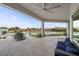 Inviting outdoor living space with a covered patio, comfortable seating, and a view of the pool at 4050 N Tomsik St, Las Vegas, NV 89129