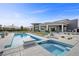 Modern home featuring a swimming pool, hot tub, and desert-style landscaping, perfect for outdoor living at 4050 N Tomsik St, Las Vegas, NV 89129
