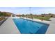 Long pool perfect for lap swimming, surrounded by desert landscaping and white gravel at 4050 N Tomsik St, Las Vegas, NV 89129