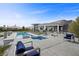 Stunning modern home with a luxurious pool and spa, surrounded by desert landscaping and ample patio space at 4050 N Tomsik St, Las Vegas, NV 89129