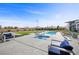 Inviting backyard showcasing a pool, spa, sleek patio furniture, and well-manicured landscaping at 4050 N Tomsik St, Las Vegas, NV 89129