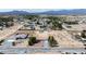Aerial view of the property showing home, drive, and landscaping within a serene community with mountain views at 480 China St, Pahrump, NV 89048