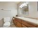 Functional bathroom features a vanity with wooden cabinets, a white sink, and a framed mirror at 480 China St, Pahrump, NV 89048