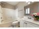 Bathroom features a shower and tub combination, a sink and vanity, and tiled floors at 480 China St, Pahrump, NV 89048