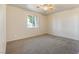 Neutral bedroom with carpet, a ceiling fan, and a window offering ample natural light at 480 China St, Pahrump, NV 89048