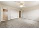 The bedroom features plush carpeting, closet, ceiling fan, and an adjacent bathroom at 480 China St, Pahrump, NV 89048