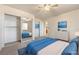 Virtual staged bedroom featuring a mirrored closet, bedding, and dresser enhancing the room's visual appeal at 480 China St, Pahrump, NV 89048