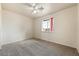 Neutral bedroom with carpet, a ceiling fan, and a window offering natural light at 480 China St, Pahrump, NV 89048