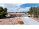 Inviting single-story home featuring a tile roof, two-car garage, and low-maintenance desert landscaping at 480 China St, Pahrump, NV 89048
