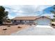 Charming one-story home featuring an attached garage and ample driveway parking at 480 China St, Pahrump, NV 89048