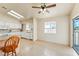 Eat-in kitchen area with tile floors, white cabinetry, and natural light, flowing to outdoor patio at 480 China St, Pahrump, NV 89048