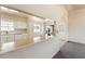 Bright and airy kitchen overlooking the living area, featuring white cabinets and lots of light at 480 China St, Pahrump, NV 89048