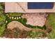 Aerial view of a secluded back yard with a large custom stone patio and lush garden area at 4909 Ocean Shores Way, Las Vegas, NV 89130