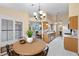 Open-concept dining area with a round table, seamlessly connected to the kitchen at 4909 Ocean Shores Way, Las Vegas, NV 89130