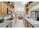 Bright kitchen featuring stainless steel appliances and an adjacent dining area at 4909 Ocean Shores Way, Las Vegas, NV 89130