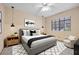 Stylish main bedroom with modern furniture, neutral tones, and ample natural light at 4909 Ocean Shores Way, Las Vegas, NV 89130