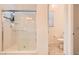 Tiled walk-in shower featured in a bathroom with a view of the toilet at 498 Pebble Run Ave, Henderson, NV 89011