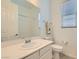 Bathroom featuring a modern sink, and a combination shower and bathtub at 498 Pebble Run Ave, Henderson, NV 89011