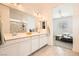 Clean bathroom with double sinks, modern fixtures, and natural light at 498 Pebble Run Ave, Henderson, NV 89011