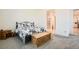 Relaxing bedroom featuring a comfortable bed, natural light, and neutral tones at 498 Pebble Run Ave, Henderson, NV 89011